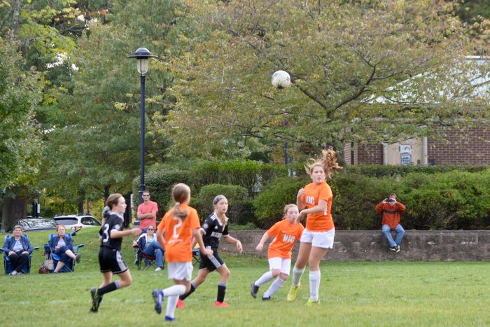 Girls Soccer team doing heading practice in Bergen County, NJ